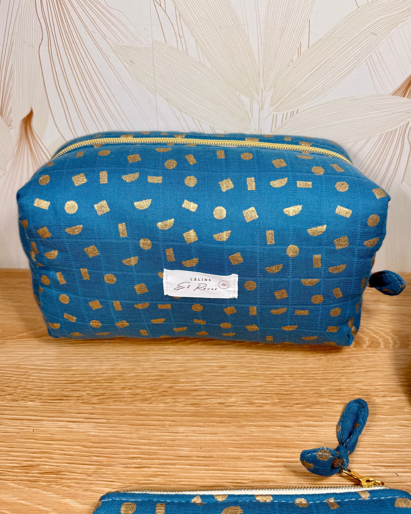 calins et reves trousse de toilette bleu et or