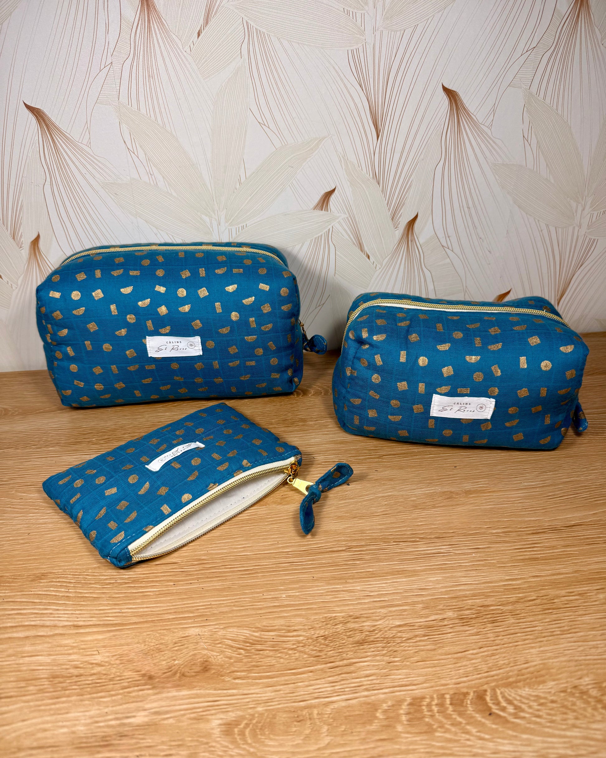 calins et reves trousse de toilette bleu et or